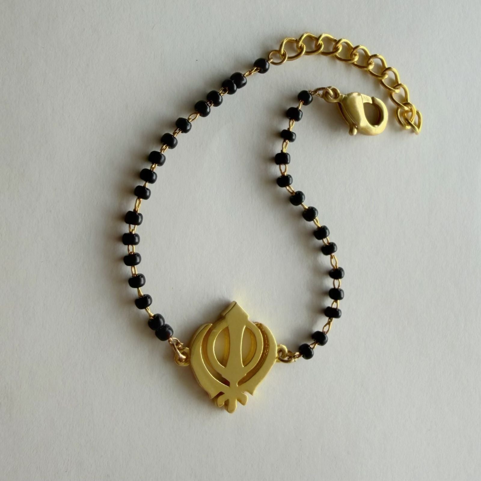 Women Khanda 22k Gold-plated Brass Bracelet with Black Onyx